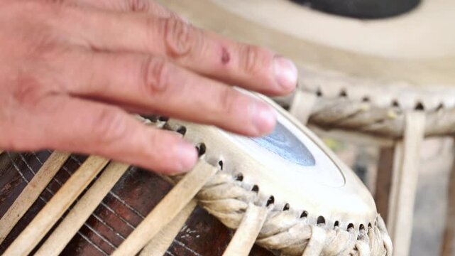 Musician playing tabla in India, exploring traditional music