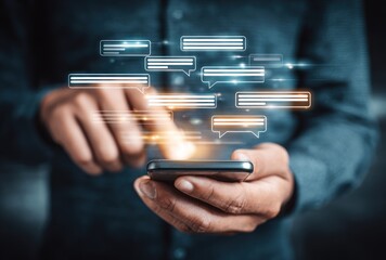 A person touches a smartphone with speech bubbles hovering, representing digital communication and technology