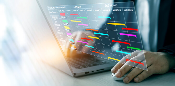 Project manager updating tasks and milestones progress planning with calendar interface for company.Business Project Management System.