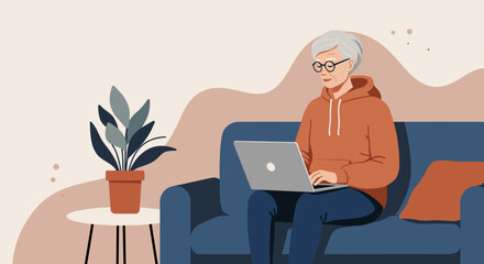 Senior woman comfortably using a laptop on a sofa at home, representing digital connection, online learning, and a modern relaxed lifestyle for older adults.