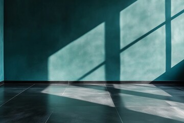 Obraz premium Teal wall with gentle shadow effects and polished black floor.