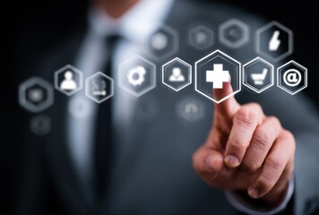 Fototapeta premium A suited man interacts with translucent icons, a plus sign highlighted, suggesting technology and healthcare integration