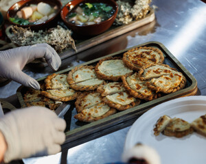 Delicious and Freshly Cooked Pancakes Served Alongside Bowls of Soup, Healthy Vegetables