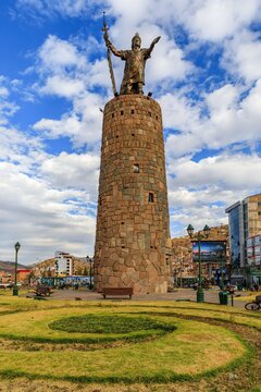 Ovalo de Pachacutec in Cusco, Peru, under a partly cloudy sky.