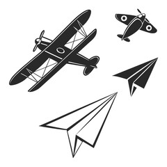 Black silhouettes of airplanes and paper planes biplane © Sa
