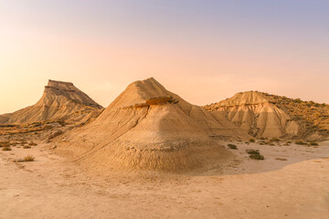Spectacular Cabezos Rock Formations at Sunset in Bardenas Reales Natural Park Spain. Erosion hills, golden hour light, semi-desert badlands, landscape