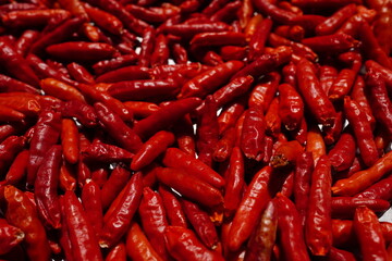 Dried red chili peppers are brightly colored and beautiful.