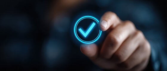 Hand touches a glowing blue checkmark symbol in a circle against a blurred dark background. Approval or completion concept