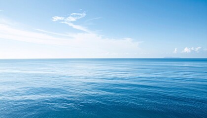 Obraz premium Tranquil azure waters merging with a cerulean sky creating a serene vista
