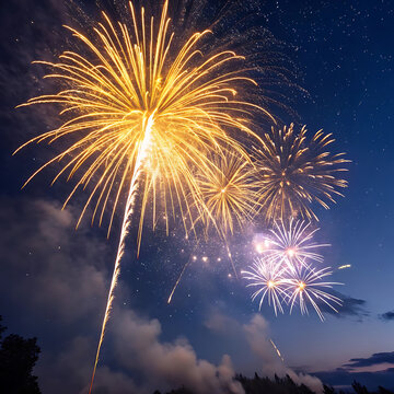 Bright golden and white fireworks exploding in the dark night sky with smoke trails
