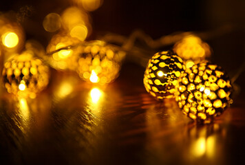 yellow garland in the form of small lanterns, creates pleasant lighting and a beautiful pattern on...