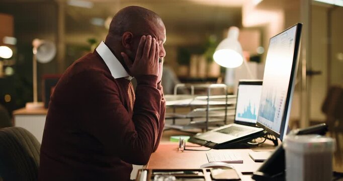 Computer, headache and night with business black man at desk in office for trading frustration or stress. Data, evening and stock market with mature employee at work for financial debt or loss - Powered by Adobe