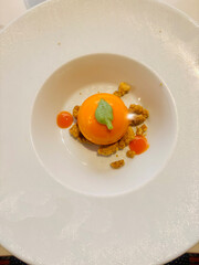 Elegant gourmet dessert, realistic orange fruit, decoration on top
