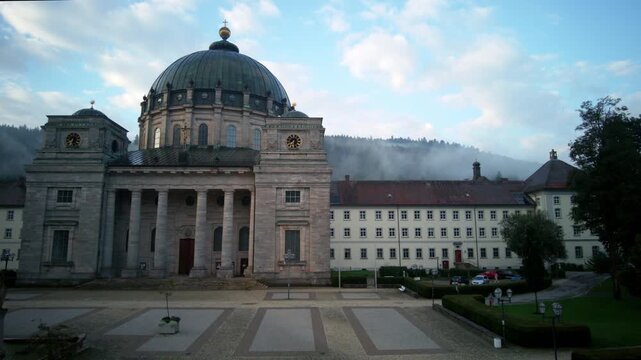 Timelapse of sunrise in a cloudy day at Dom Saint Blasien Cathedral in Swartzwald (Black Forest Germany)