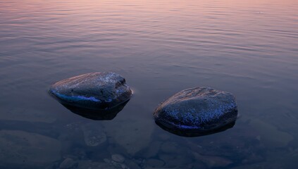 Twin Stones at Twilight, Reflecting Still Waters and Subtle Color Play.