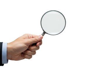Light-skinned hand meticulously holding a sleek magnifying glass, conveying precision and strategic attention to detail on a seamless bright white studio background, concept of focused analysis