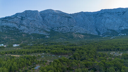 Obraz premium Biokovo mountain range and mountain valley by the Adriatic Sea. Croatia, Makarska