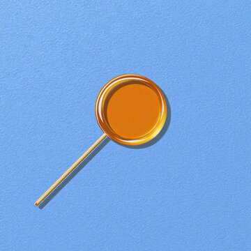 Round caramel lollipop on a stick