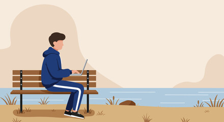 Young man working remotely on laptop outdoors by the water. Illustrates flexible work, digital nomad lifestyle, or studying in a peaceful natural environment.