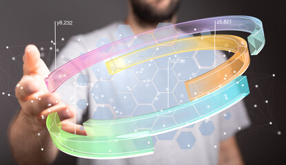 A man interacts with a holographic display showing dynamic data charts and graphs.  Modern technology concept.