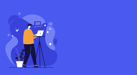 A person works on a laptop placed on a stand, engaging in remote work or online communication. Ideal for concepts like freelance, productivity, and digital communication.