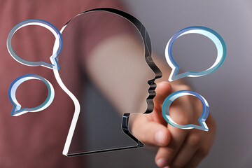 Abstract image of a head with speech bubbles,representing communication, feedback, and...