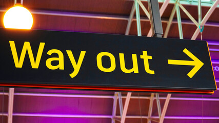 black sign with yellow inscription way out. exit from the premises