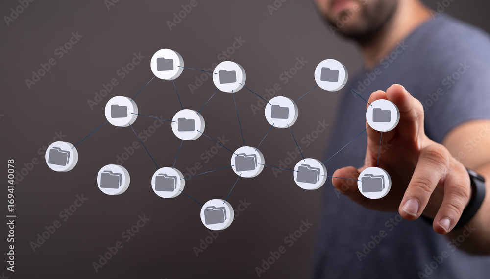Poster man interacts with a network of digital files and folders. cloud storage, data management.