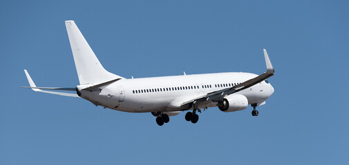 Airplane take off on the blue sky, Aircraft flying on sky background. White passenger jet plane in...