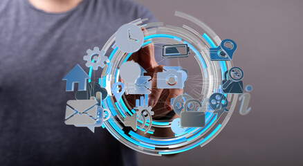Abstract image of person interacting with digital icons representing technology, communication and data.