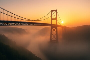 Obraz premium Dramatic sunrise over the bridge veiled in mist offering scenic landscape view