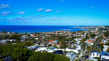 Coogee beach from high NSW Australia.Coogee beach area from above.Stunning coastal view capturing vibrant houses and serene ocean at midday near a bustling beach community