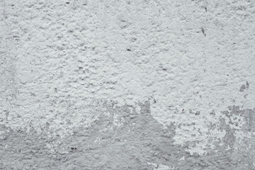 Textured wall surface with peeling paint and weathered concrete background