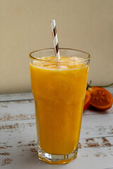 Refreshing Colombian tamarillo juice served in a glass. Exotic tropical fruit drink, natural, vibrant, and perfect for healthy lifestyle photography