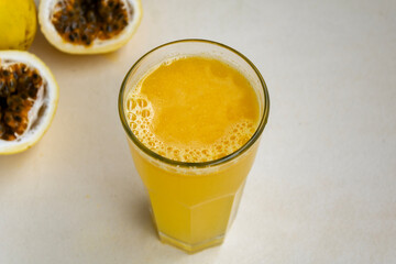 Homemade passion fruit juice in tall glass – Healthy drink concept