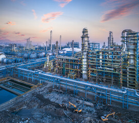 Aerial view of a large oil refinery and petrochemical industrial plant with intricate pipelines and...