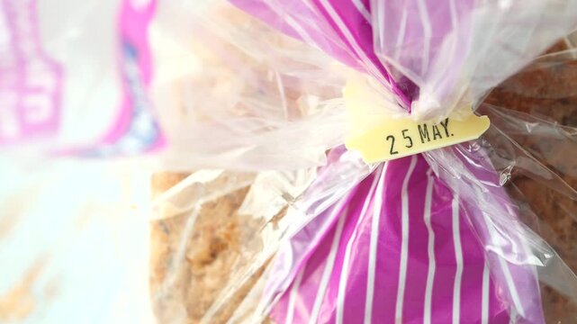 bread in plastic packaging with date label 4k video