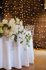 Elegant floral arrangement enhances a luxurious dining experience during a special event