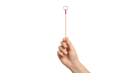 a hand holds a tiny heart wand whimsical romance, valentines day magic, isolated on transparent background