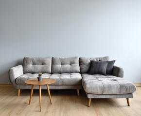 A light gray sectional sofa, complemented by a light wooden coffee table, sits in a modern living room with a neutral color palette.