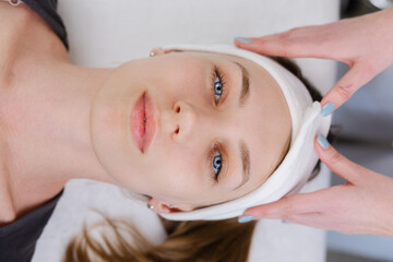 Professional Beautician Performing Facial Treatment in Spa