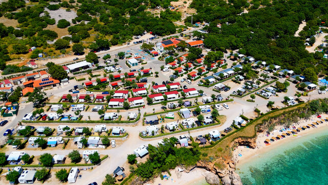 Campsite at Campig Skrila, Krk Island, Stara Baska Croatia, Aerial View of the Mountains and Coast With Boats, Beaches and Adriatic Sea. The Seaside Rv Campmobiles on a Summer Beautiful Coastline