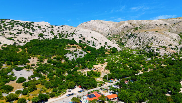 Campsite at Campig Skrila, Krk Island, Stara Baska Croatia, Aerial View of the Mountains and Coast With Boats, Beaches and Adriatic Sea. The Seaside Rv Campmobiles on a Summer Beautiful Coastline