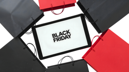 Black friday shopping concept with tablet and red black bags isolated on the transparent background for online sales promotion