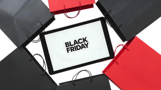 Black friday shopping concept with tablet and red black bags isolated on the transparent background for online sales promotion