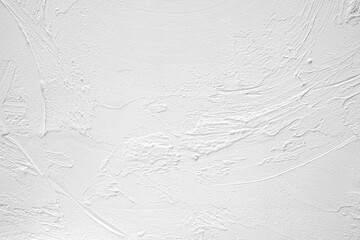 Textured white wall surface with subtle patterns and variations