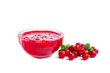 Lingonberry jam with lingonberries and leaves isolated on white background.