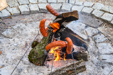 Roasting sausages in the garden bonfire