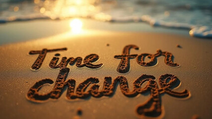 'Time for change' writing in the sand