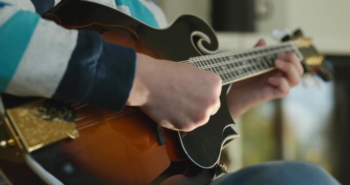 Caucasian Kid Play Mandolin at Home. European Boy Practice Music 4K 10-bit